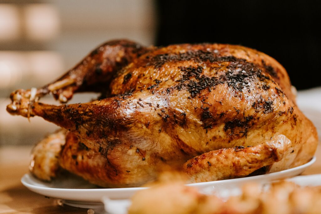 A oven bake turkey on a plate. 