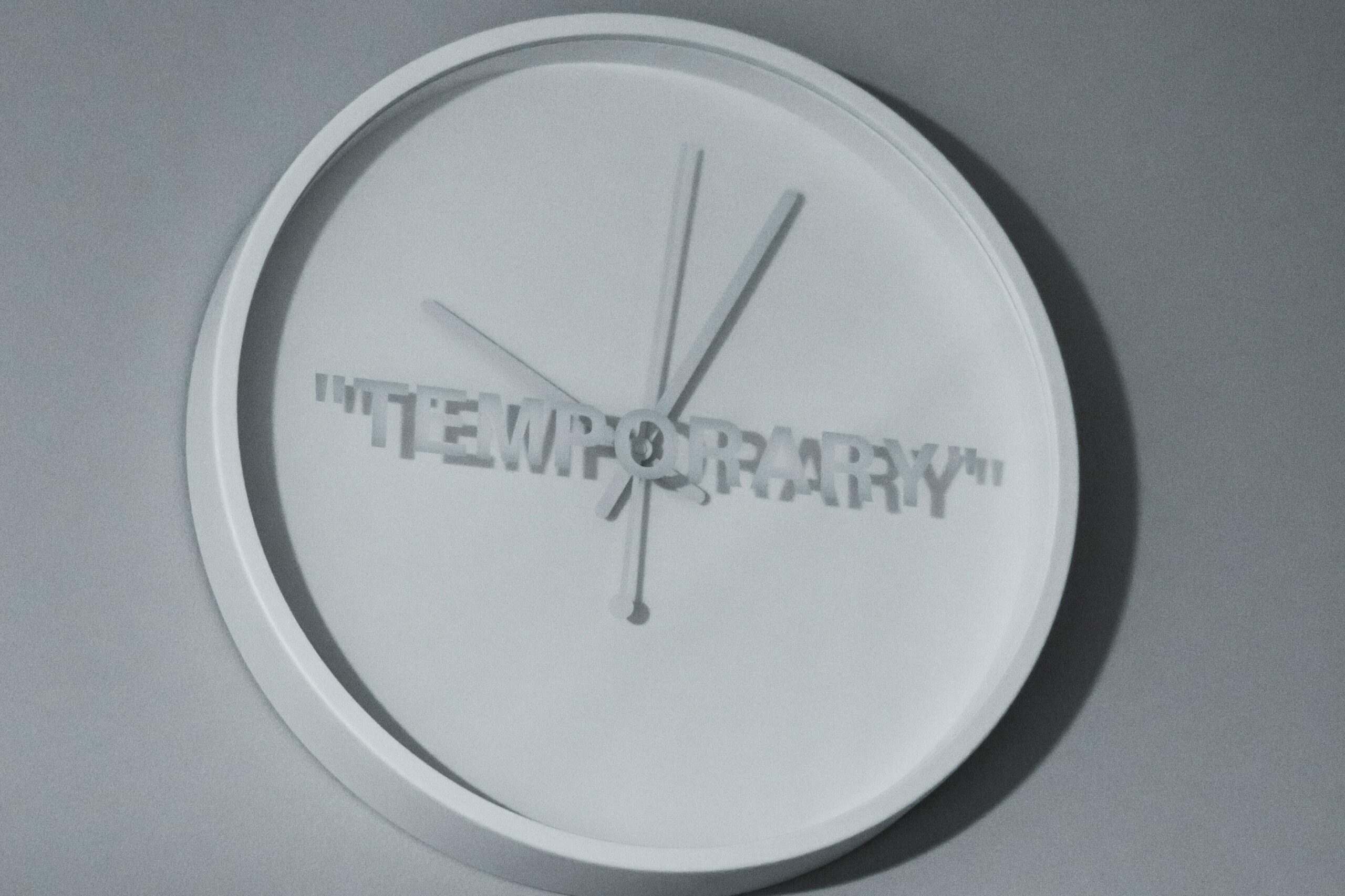 A clock with a letter 'Temporary.'